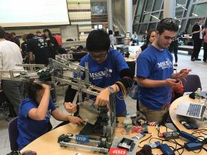 Students from 2018 work on an MSSM VEX Robot