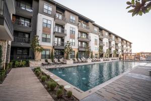 building of modern apartments facing a community pool