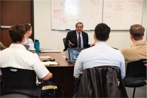 Former Secretary of Defense Leon Panetta engages with students in the Department of Defense Analysis Command and Leadership course at NPS.