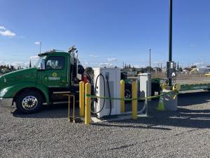 Image of a DCFC installed by Chateau Energy Solutions with a Sunbelt Rentals' truck and trailer