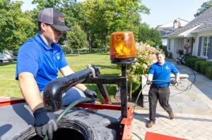 J. Blanton Plumbing technician performing a trenchless sewer repair, highlighting the company's specialized services in trenchless sewer repair, blocked drain plumbing, and sewer line cleanouts for Naper Settlement's All Hallows Eve 2024 event.