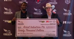 Arinze Eze of Aerial Mechanica receives the second installment of the $40,000 Grant Awarded by the Oregon UAS Accelerator.
