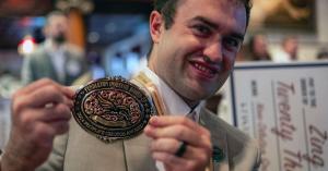 Ian Annase, Zing Drone Solutions, displays the People's Choice Award earned at the 2024 Pendleton Investor Round-Up, our previous cohort's investor pitch event.