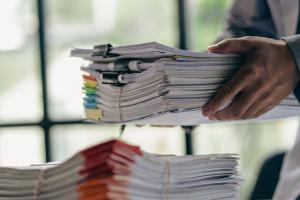 Business administration and information documents on the desk