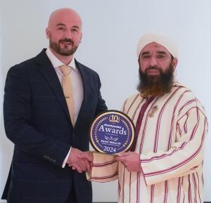 Syed Muhammad Faisal Sami with his UK Volunteer of the Year Award 2024