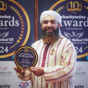 Syed Muhammad Faisal Sami with his UK Volunteer of the Year Award 2024