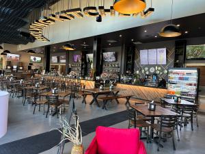 Revolving Kitchen view of dining and bar area