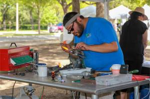 Nick Gomez demonstrates glassblowing techniques