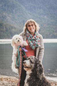 Kathryn is on a beach in British Columbia mwith her two dogs, Oscar and Daisy