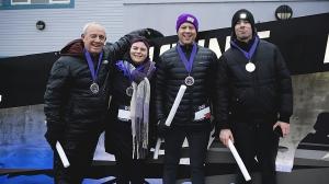 A group photo from the Kicking PancreAS fundraiser featuring Heather Cutler’s brother, nephew, daughter, and Christopher Cutler (founder of The Heather Cutler Foundation), all wearing medals and dressed warmly.