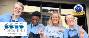 Four smiling staff members from 'A Special Blend' coffee shop stand together, displaying peace signs, with an IBCCES Certified Autism Center™ badge in the background.