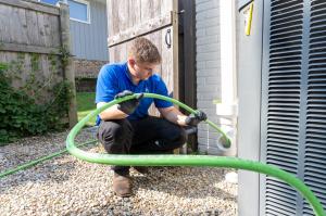  J. Blanton Plumbing technician conducting a trenchless sewer repair, showcasing the company's expertise in trenchless sewer repair, emergency plumbing services, and sewer maintenance in support of the Northbrook Park District's Halloween Pet Parade 2024.