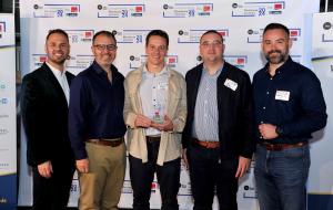 A photo of the Nova Blue team accepting the first of their awards on the evening.