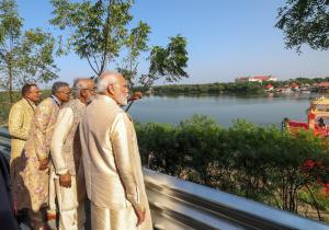 Savji Dholakia and his brothers present Bharatmata Sarovar to PM Modi, symbolising water conservation efforts.