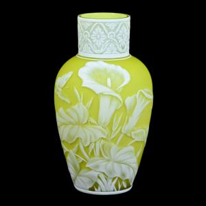 Highly detailed English cameo art glass vase, 9 inches tall, with bright citrine yellow ground and amazing white cameo cutback overlay featuring a rose, lily and butterfly décor (est. $1,500-$2,500).