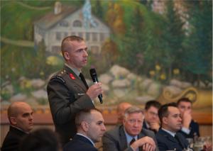 Maj. Angelos Arampatzis special acquisition officer of the Hellenic Navy general staff, asks a question at the NPS International Alumni Symposium.