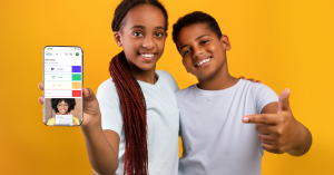 Two children holding a mobile phone with Electus Education's Life Hub App on the screen, that is backed by The American Heart Association Social Impact Fund