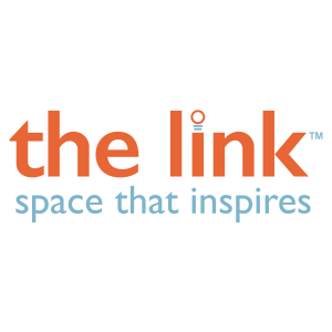 The link logo with 'the link' in lowercase orange text, featuring a stylized dot above the 'i' resembling a lightbulb, symbolizing inspiration and creativity. The tagline 'space that inspires' is written below in light blue, emphasizing the brand's missio
