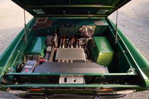 Close-up of the electric powertrain inside the 1977 Ford Bronco built by Kincer Chassis, showing intricate EV components and wiring