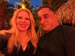 Photo of a woman and a man outside the Hard Rock Cafe, Miami