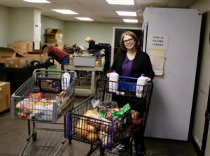 Executive Director Kirsten Wageman with food drive donations