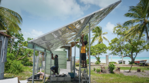 Image shows the installation of a solar-powered water farm in Kiribati.