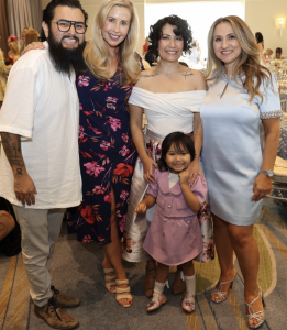 Miracles for Kids Co-Founder & CEO Autumn Strier and Laura Collins with 2024 grant recipient Norma Ramos and her family