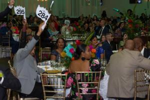 Guests at Ray of Hope Gala taking part in the live auction