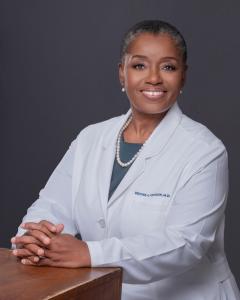 Dr. Denise Johnson in lab coat.