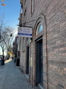 Expedite Passport's Building, its grey and has their white sign