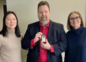 Gifford receives his King Charles III medal from Karen Lee, PhD President and CEO of Parkinson Canada and Joanne Baker, PhD CEO of Parkinson Society British Columbia