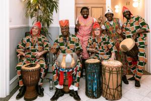 Henri Gaobi and his troupe performing at the Côte d'Ivoire Embassy in London during the World Travel Market 2024 reception.