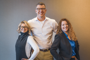 This image shows the co-hosts of Everyday Practices Dental Podcast (from left): Dr. Maggie Augustyn, Dr. Chad Johnson, and Regan Robertson