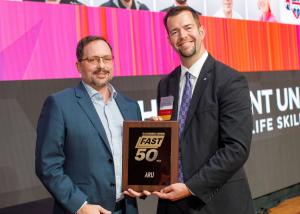 ARU Chief Financial Officer, Taylor Campbell, accepts the Fast 50 Award from the Triad Business Journal.