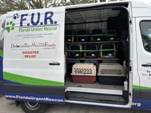 FUR Transport van loaded with crates during a hurricane evacuation.