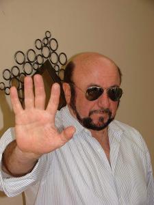 The character is molded gradually into what the REAL Les Grossman is in the movie Tropic Thunder, rocking Hollywood by being a high powered talent mogul.