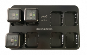 Black docking station with three Artius nodes docked in it