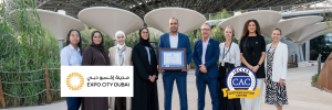 Expo City Dubai team receiving their CAC framed certificate