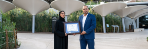 Expo City Dubai team receiving their CAC framed certificate