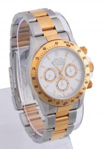 1997 Rolex Cosmograh Daytona 18k yellow gold and stainless-steel wristwatch, model # 16523, featuring a Swiss made perpetual Zenith movement and a white dial, with papers ($18,150).