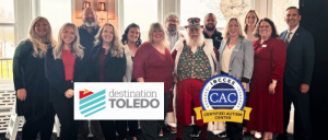 Destination Toledo team with Santa Tom of Toledo Santa, both Certified Autism Centers™.