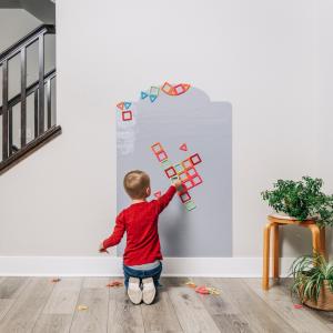 Magna Dream Board, a large 32x48-inch magnetic whiteboard, showcasing creative magnetic designs and family collaboration in a cozy home setting.
