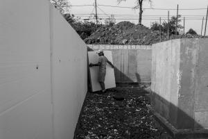 Carpenter installing foundation insulation