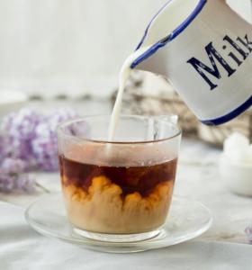 Pouring milk in tea