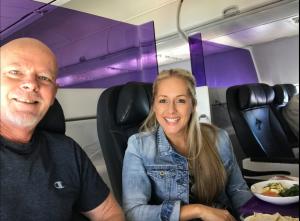 Myles on a flight with Prosperity Of Life Branding & Communications Manager, Kirsty Goldsworthy.