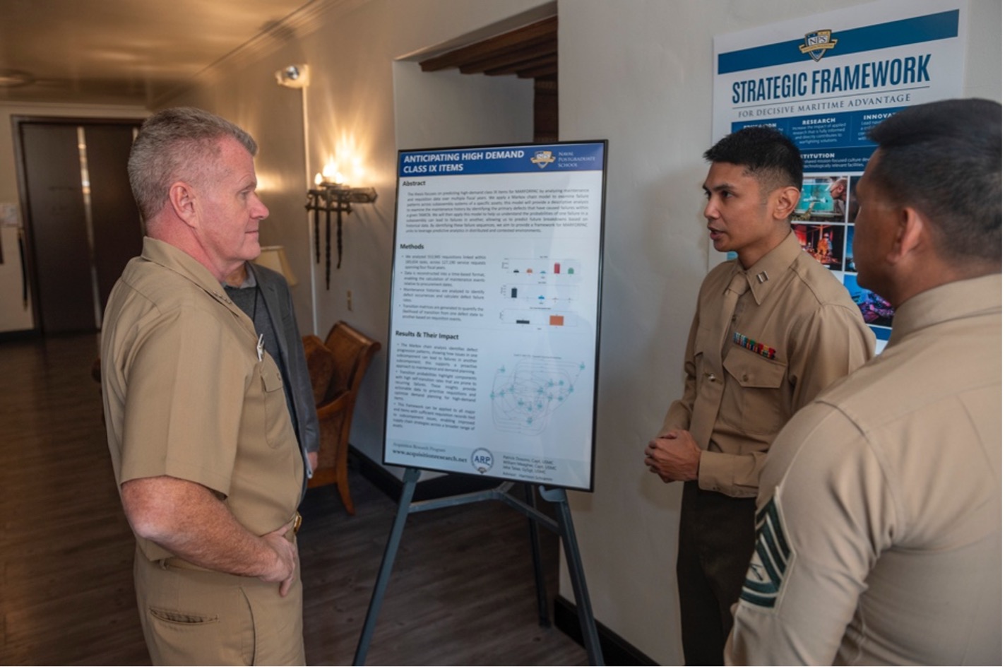 U.S. Navy Adm. Samuel J. Paparo, commander, U.S. Indo-Pacific Command (INDOPACOM), discusses student applied research solutions at the Naval Postgraduate School.