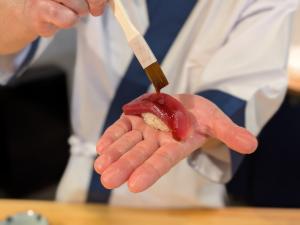 sushi chef making koshu sushi