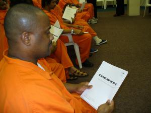 Criminon participant with course materials