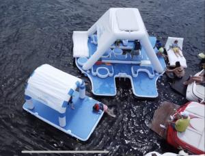 an Inflatable island party canopy floating on the water.