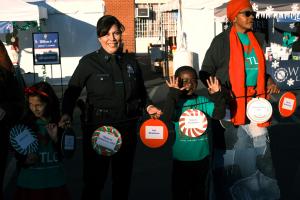 LAPD Captain Amira Eppolito contributing to the wonderful ninth annual Los Angeles Trial Lawyers' Charities "Comfort & Joy" event